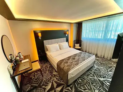 a hotel room with a bed and a large window at Weingart Istanbul in Istanbul
