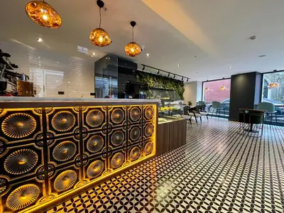 a restaurant with a bar with a counter at Weingart Istanbul in Istanbul