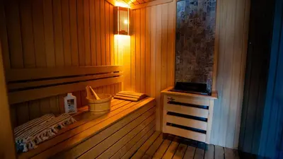 a sauna with a light on a wooden floor at BANDIRMA PALAS OTEL in Bandırma