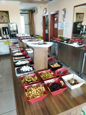 a buffet line with many different types of food at EMOS HOTEL in Istanbul