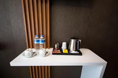 a white table with cups and water bottles on it at KAR BEYAZ HOTEL BURSA in Bursa