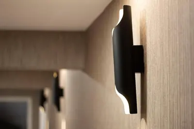 a black door handle on a wooden door at KAR BEYAZ HOTEL BURSA in Bursa