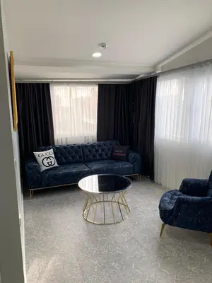 a living room with a couch and a coffee table at Taksim Galatist Hotel in Istanbul