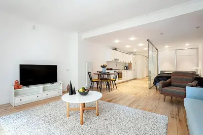 a living room with a couch and a tv at NOA - Tatar Beyi 18 in Istanbul