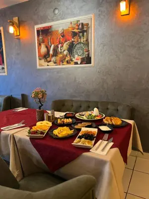 a table with plates of food on top of it at Sultan Suleyman Palace Hotel & Spa in Istanbul