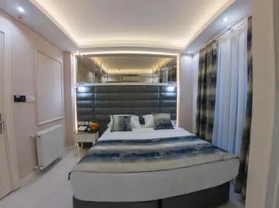 a bedroom with a large bed in a room at Crowned Hotel in Istanbul