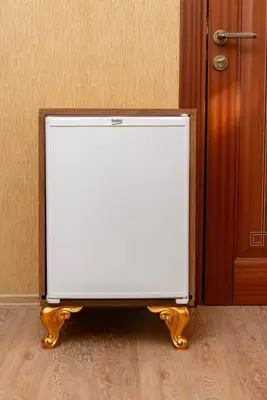 a white television sitting in front of a door at The Ottoman in Istanbul