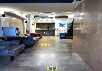 a lobby with couches and a tv in a room at Beşiktaş Serenity Hotel in Istanbul