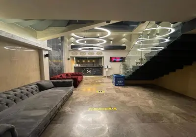 a living room with a couch and a staircase at Beşiktaş Serenity Hotel in Istanbul