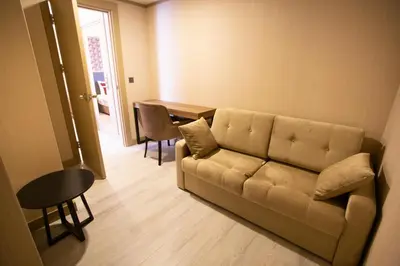 a living room with a couch and a table at Beşiktaş Serenity Hotel in Istanbul