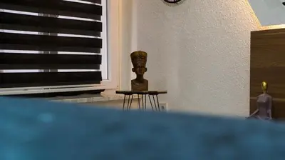 a vase sitting on a table next to a window at The Havana Residence in Istanbul