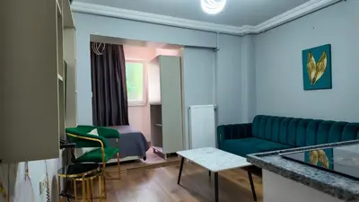 a living room with a couch and a table at Sisli House By Remar Holding in Istanbul