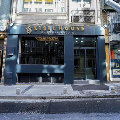 a sign for a sushi house on a city street at Sisli House By Remar Holding in Istanbul