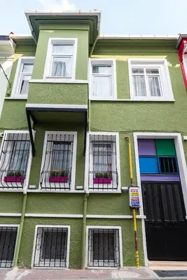 a green building with windows and plants on it at Dualis Hotel in Istanbul