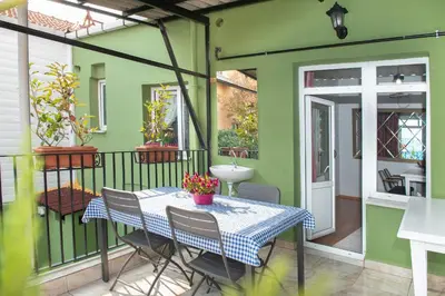 a patio with a table and chairs on a balcony at Dualis Hotel in Istanbul