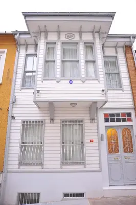 a white house with windows and a door at Dualis Hotel in Istanbul