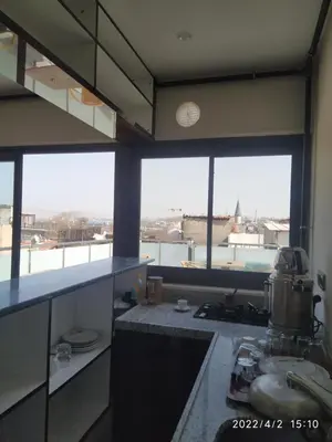 a kitchen with large windows and a view of a city at BoNaMi Hotel in Istanbul
