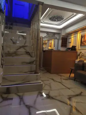a lobby with a staircase in a building at BoNaMi Hotel in Istanbul