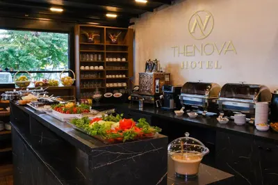 a restaurant with a counter with food on it at THE NOVA HOTEL in Yalova