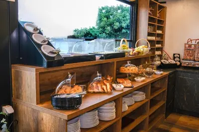 a bakery with bread and pastries on a shelf at THE NOVA HOTEL in Yalova