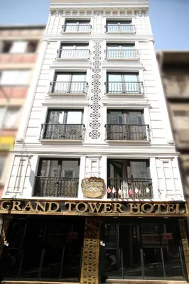a tall white building with a grand tower at The Grand Tower Hotel in Istanbul