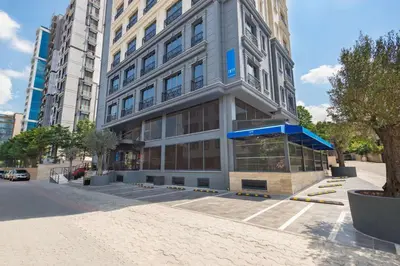 a large building on a street in a city at Tryp by Wyndham Istanbul Atasehir in Istanbul