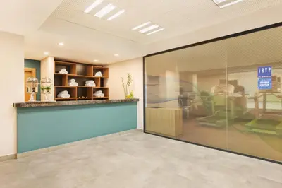 a lobby with a large glass door in a store at Tryp by Wyndham Istanbul Atasehir in Istanbul