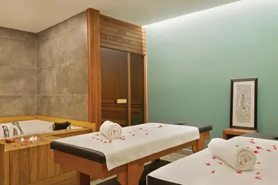a bathroom with two beds and a bath tub at Tryp by Wyndham Istanbul Atasehir in Istanbul