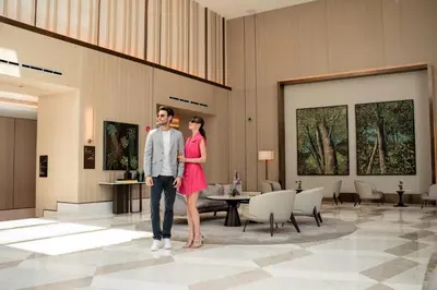a man and a woman standing in a lobby at Address Istanbul in Istanbul