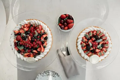 three bowls of strawberries and blueberries on a table at Address Istanbul in Istanbul