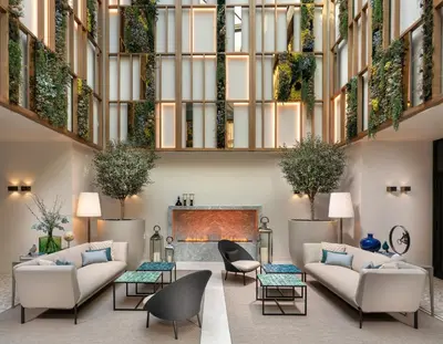 a lobby with couches and a fireplace at Address Istanbul in Istanbul