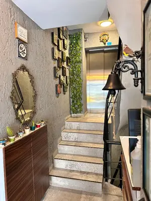 a staircase in a house with a mirror at Pera Pansiyon in Bursa