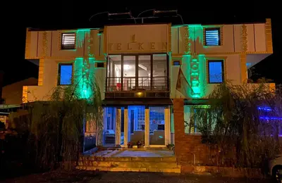 a building with green lights on it at night at yelken apart hotel in Tekirdag