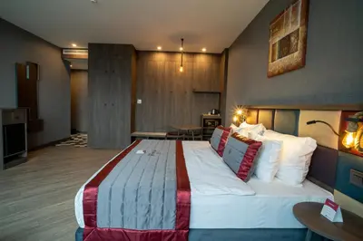 a bedroom with a large bed in a room at Ramada Encore by Wyndham Istanbul Avcilar in Istanbul