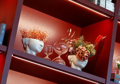 a shelf with wine glasses and flowers on it at Wanda Vista Istanbul in Istanbul