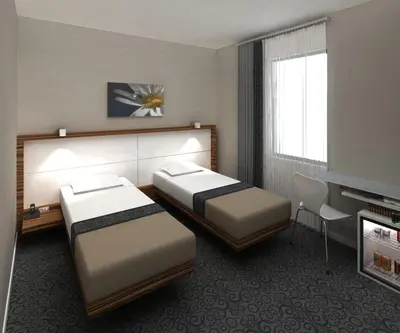 a hotel room with two beds and a television at Hotel Yenibosna in Istanbul
