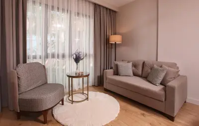 a living room with a couch and a chair at The Pearl Suites in Istanbul