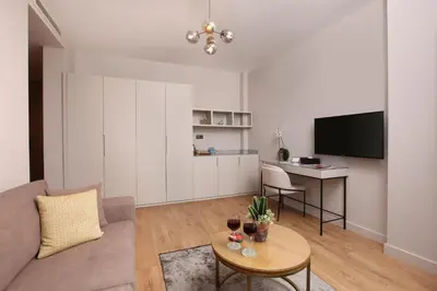 a living room with a couch and a table at The Pearl Suites in Istanbul
