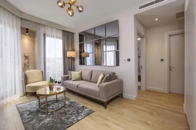 a living room with a couch and a table at The Pearl Suites in Istanbul
