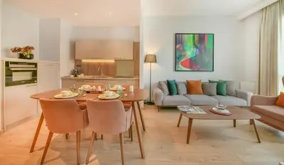 a living room with a table and a couch at Antwell Suites in Istanbul