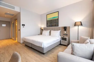 a hotel room with a bed and a couch at Antwell Suites in Istanbul