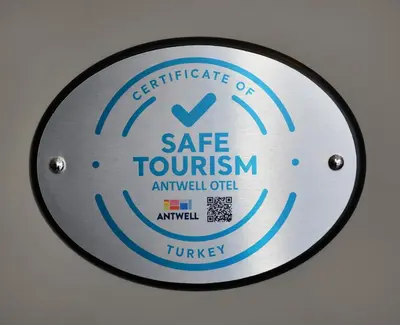 a metal plate with a safe tourism sign on it at Antwell Suites in Istanbul