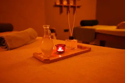 a bottle and a candle on a table at Mineo Hotel Taksim in Istanbul