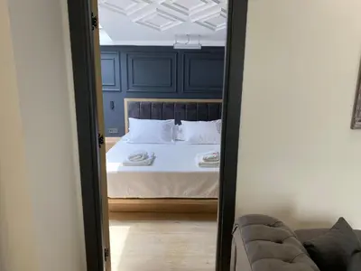 a reflection of a bedroom with a bed in a mirror at RW BOUTIQUE HOTEL in Istanbul
