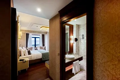 a hotel room with a bed and a bathroom at Aspera Hotel Golden Horn in Istanbul