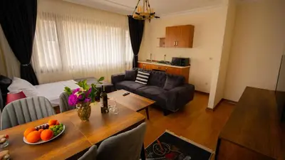 a living room with a table with fruit on it at Istanbul Galata Port Modern Suite & Apartments Taksim in Istanbul