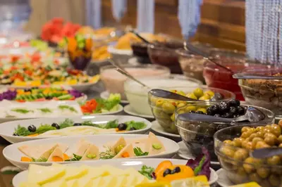a buffet with many plates of food on a table at Istanbul Galata Port Modern Suite & Apartments Taksim in Istanbul