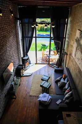 a living room with a couch and a large window at Minimalist Sapanca in Sapanca