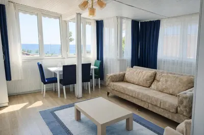 a living room with a couch and a table at Alpacino Apart Hotel in Istanbul