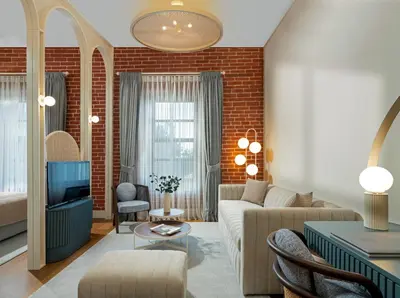 a living room with a couch and a tv at Ecole St. Pierre Hotel in Istanbul
